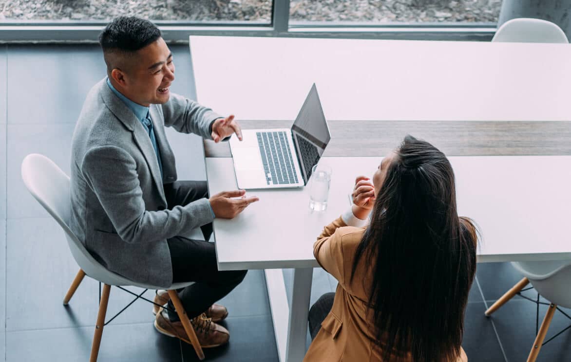 two workmates working together